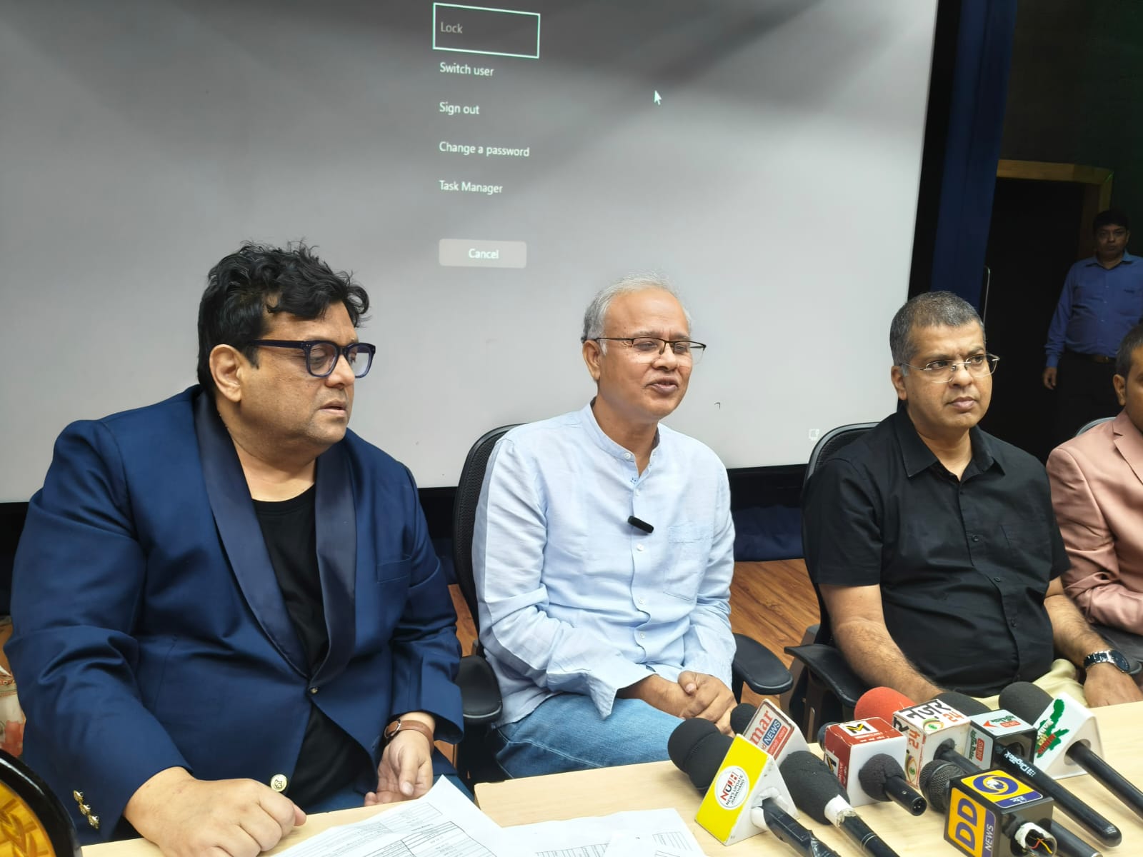 Seated panel discussion with microphones